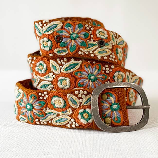 Hand-embroidered Peruvian wool belt with desert bloom motifs