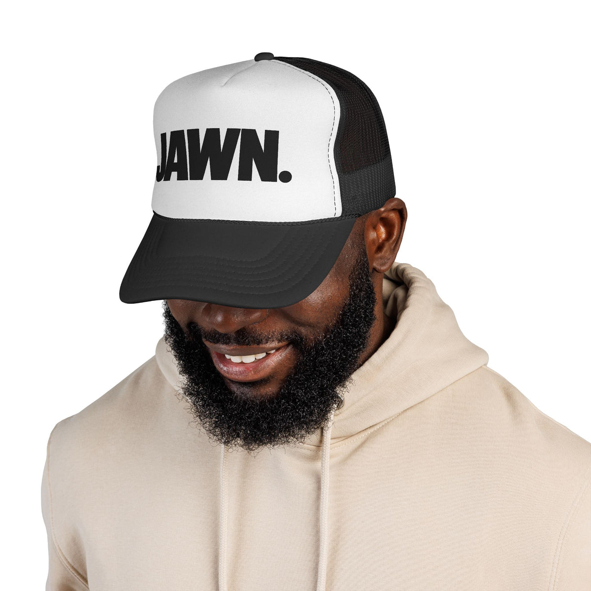 Man wearing the black-and-white JAWN. trucker hat
