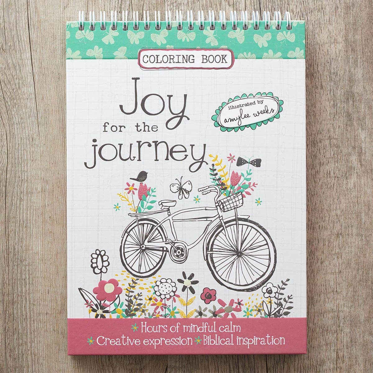 Joy for the Journey wirebound coloring book cover on a wooden surface