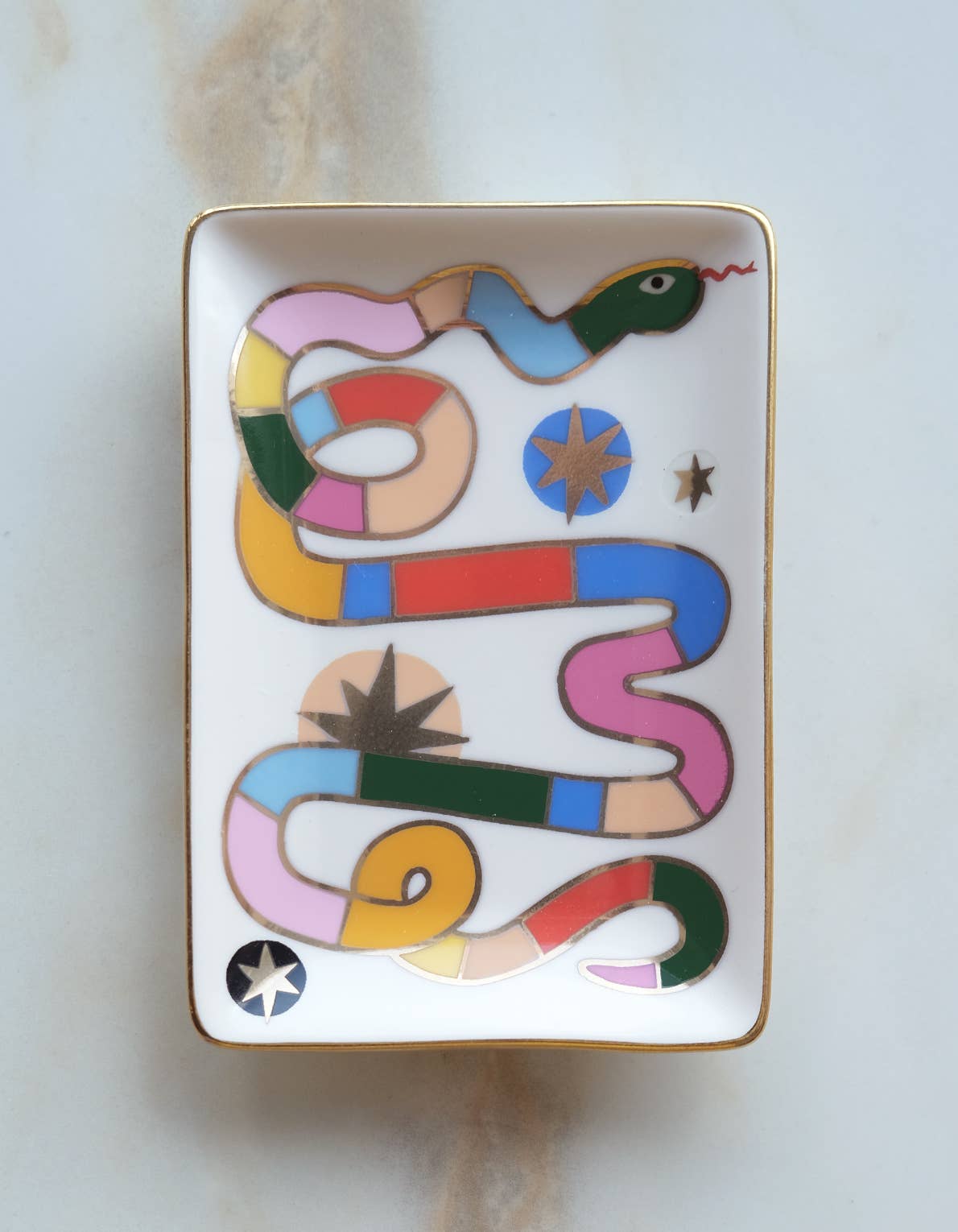 Porcelain catch-all trinket dish with whimsical rainbow snake design