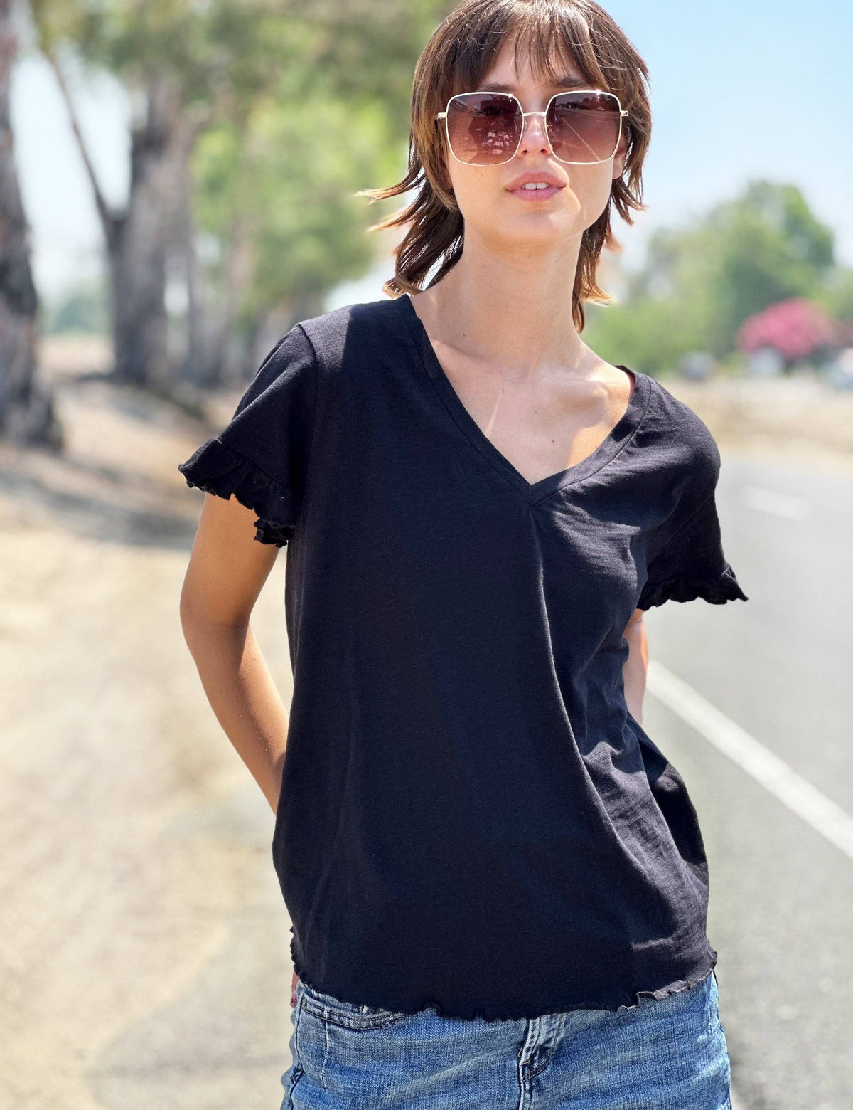 Black everyday cotton tee with feminine ruffle sleeve and v-neck