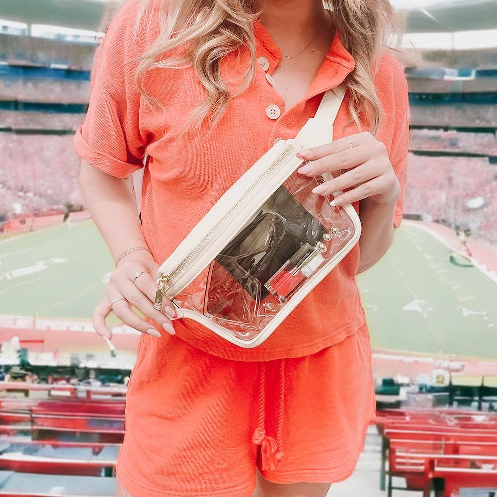 Clara cream clear bum bag at a stadium