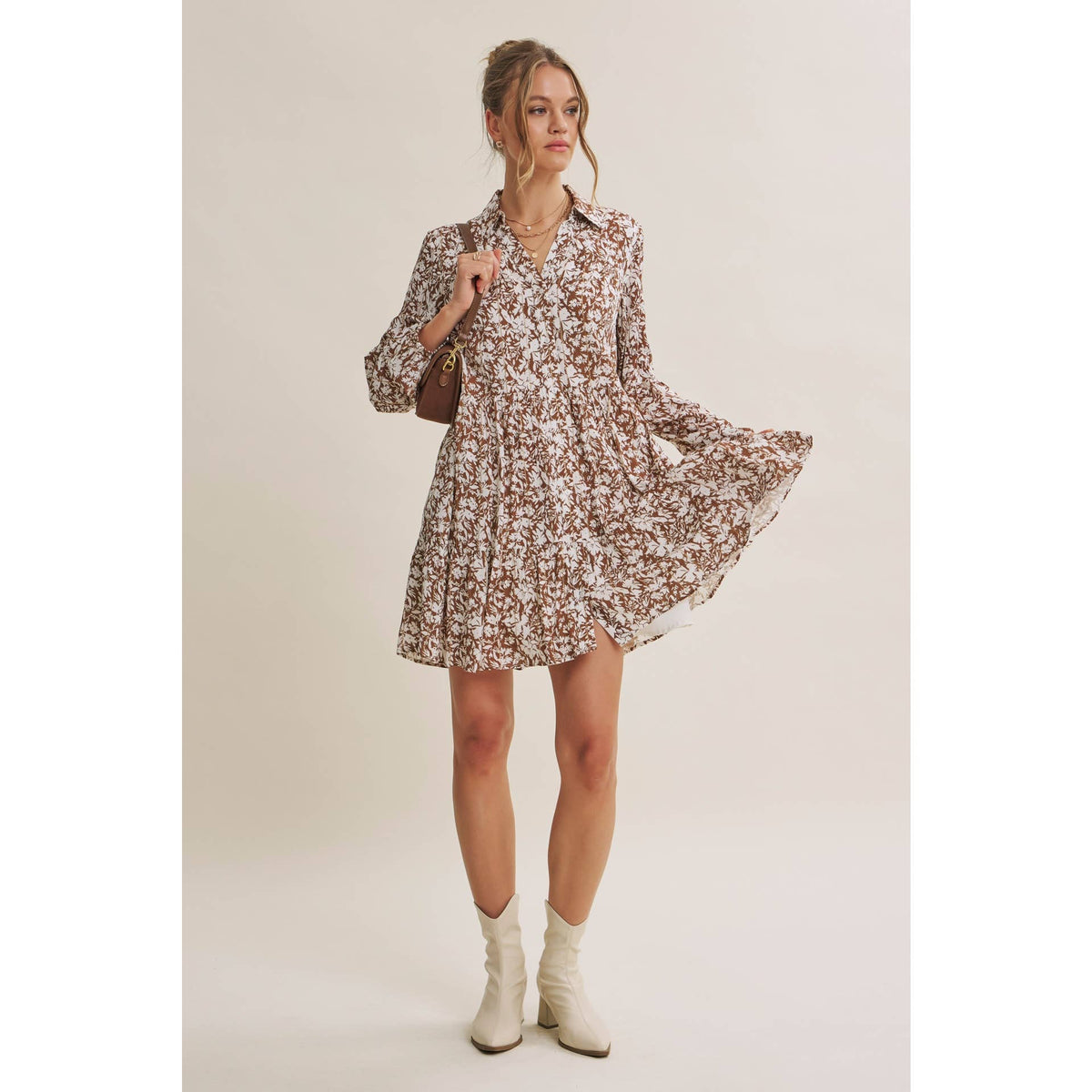 Full-length view of the Soft Autumn floral mini dress with the hem held out to show its movement.