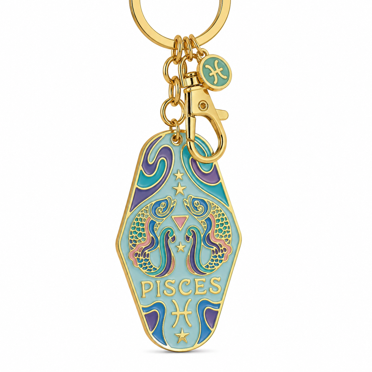 A gold-tone metal keychain featuring a coffin-shaped Pisces zodiac charm with turquoise, purple, and pink enamel details, shown on a plain white background.