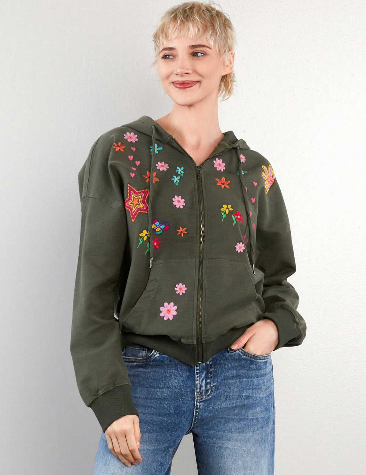 Olive zip-up hoodie with hand-drawn embroidered flowers, hearts, and stars