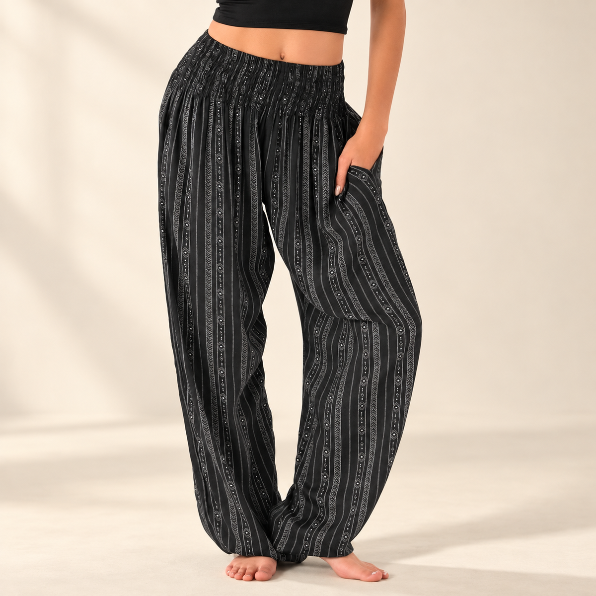 Akha Tribal Print Harem Pants with Pockets showing the smocked waistband and relaxed leg on an ivory background