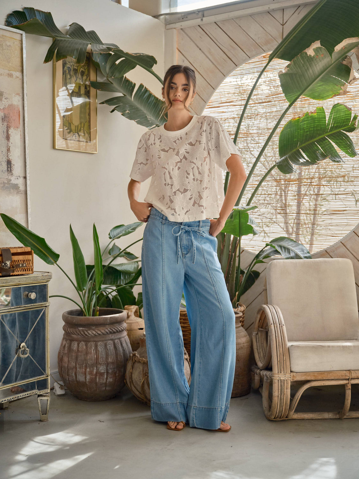Soft Bloom Floral Lace Tee in off-white styled with wide-leg blue jeans in a sunlit room
