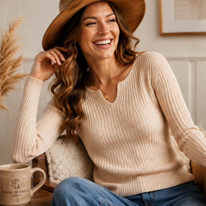 Happy woman wearing the oatmeal ribbed V-neck knit top