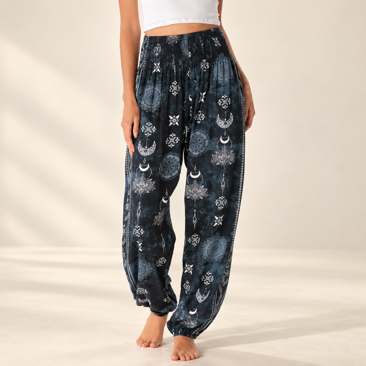 Twilight Lotus Harem Pants with Pockets showing the smocked waistband and relaxed leg on an ivory background