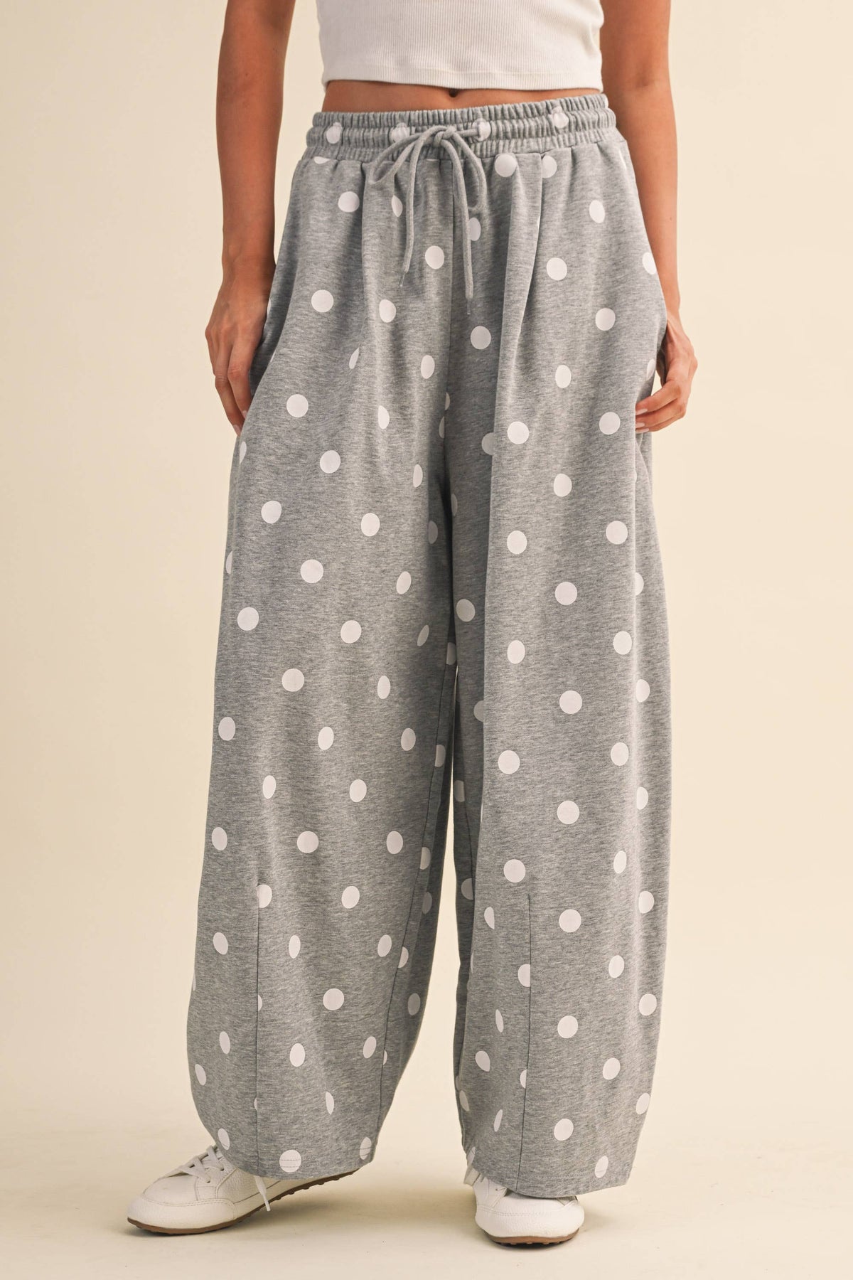 Closer front view of the elastic drawstring waist and barrel-leg silhouette