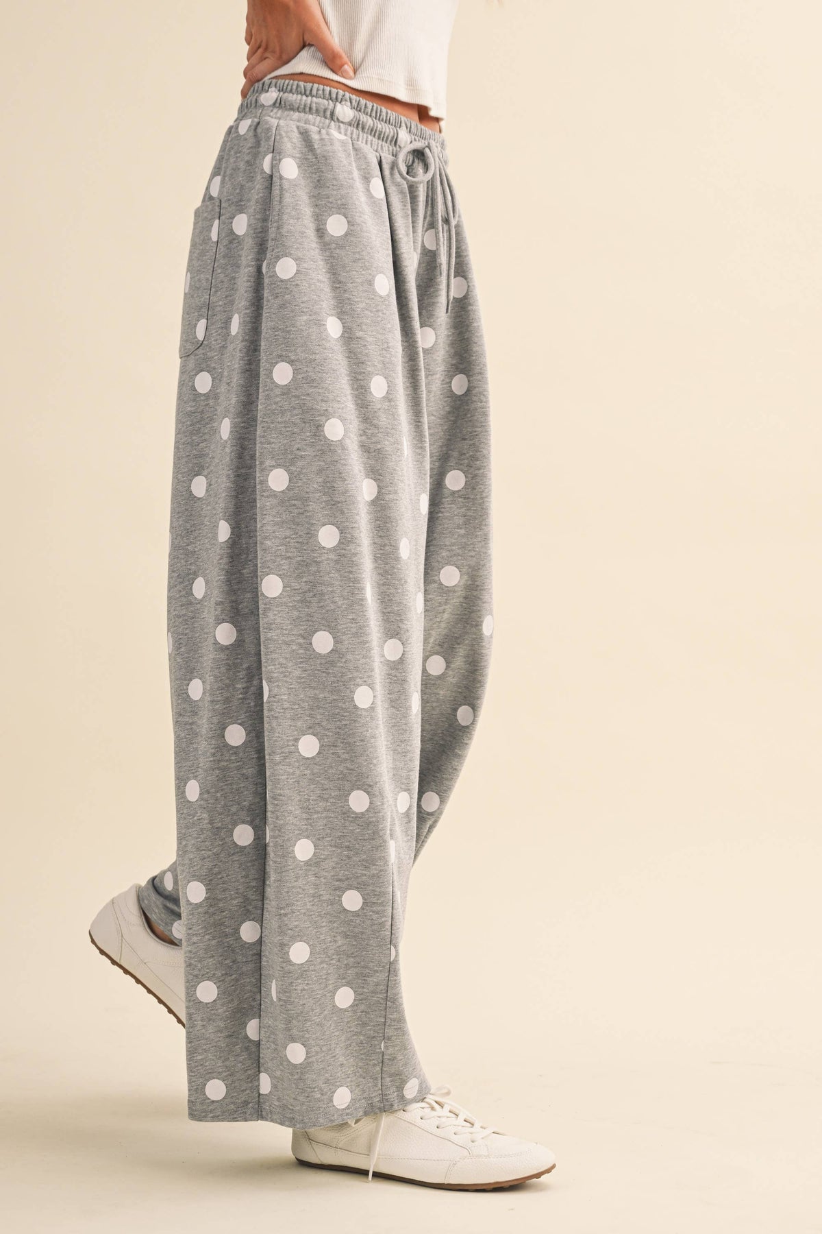 Side and back view showing the relaxed drape of the Cloud Dot sweatpants