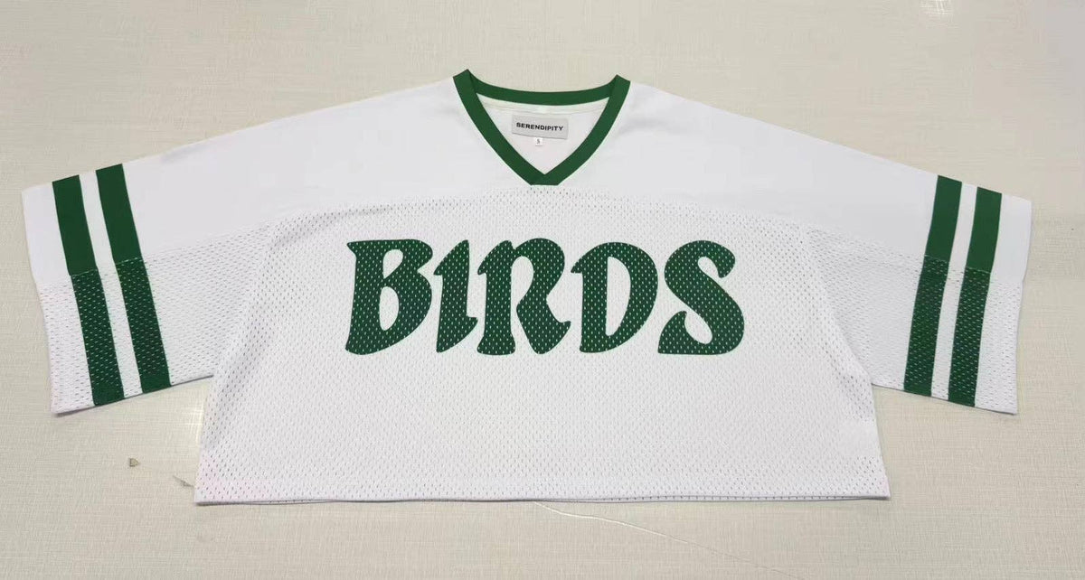 White cropped mesh B1RDS jersey with Kelly green V-neck and double sleeve stripes.