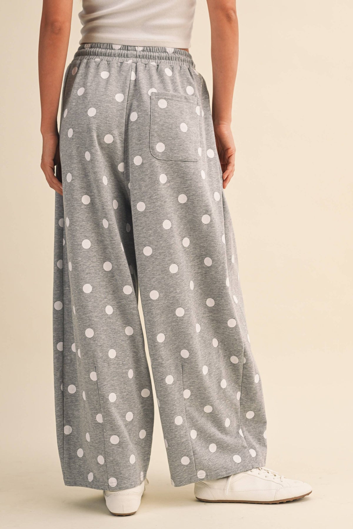 Back view of the heather-grey polka-dot barrel-leg sweatpants
