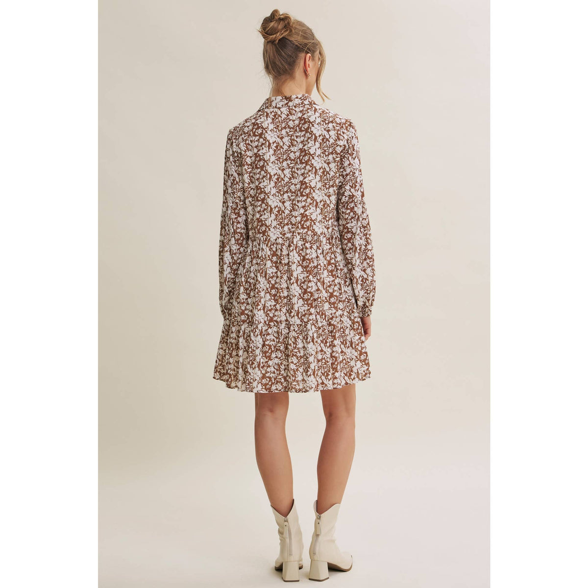 Back view of the Soft Autumn floral mini dress showing the relaxed shape and long sleeves.