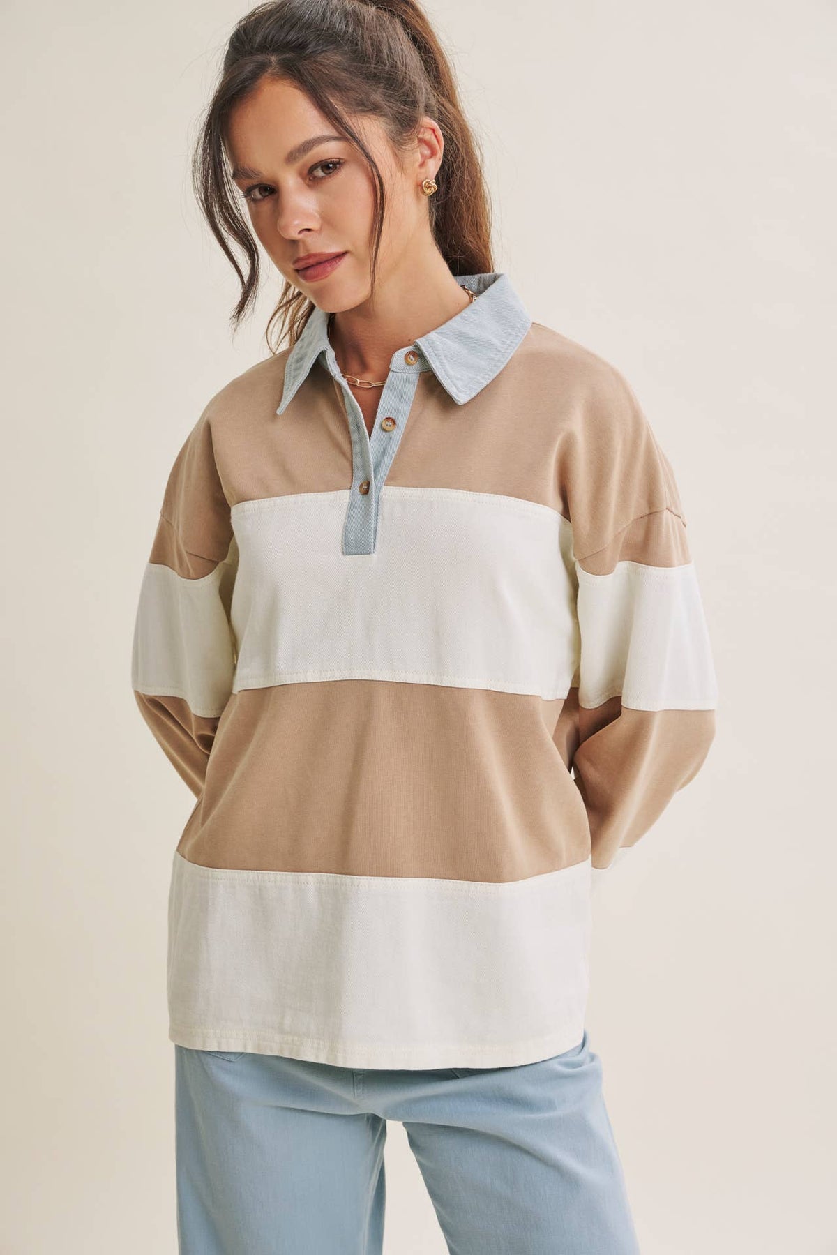 Heritage Weekend rugby top in latte and cream stripes with a pale blue collar, front view.