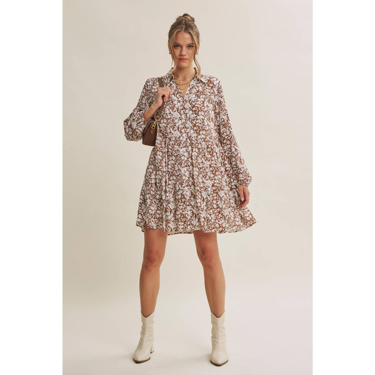 Soft Autumn button-down floral mini dress styled with a brown shoulder bag and cream boots.