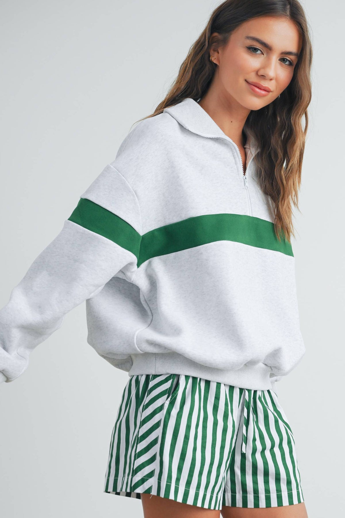 Grey and green sweatshirt sleeve and front detail