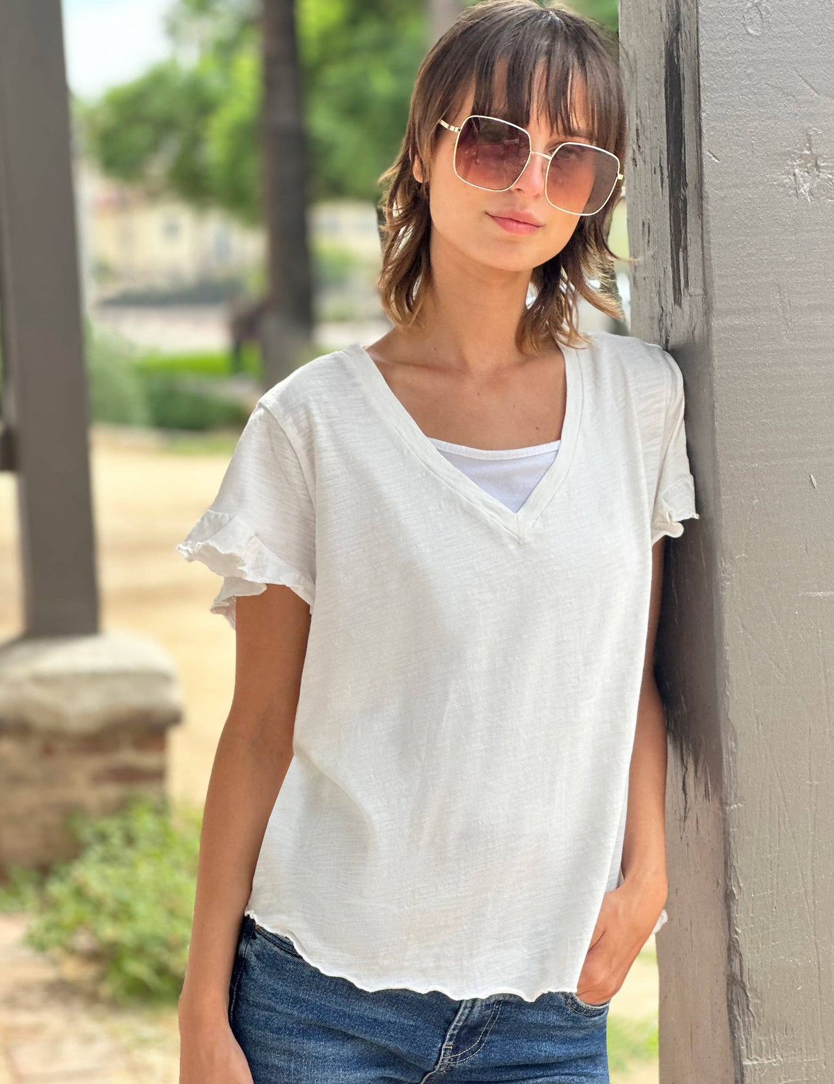 White everyday cotton tee with feminine ruffle sleeve and v-neck