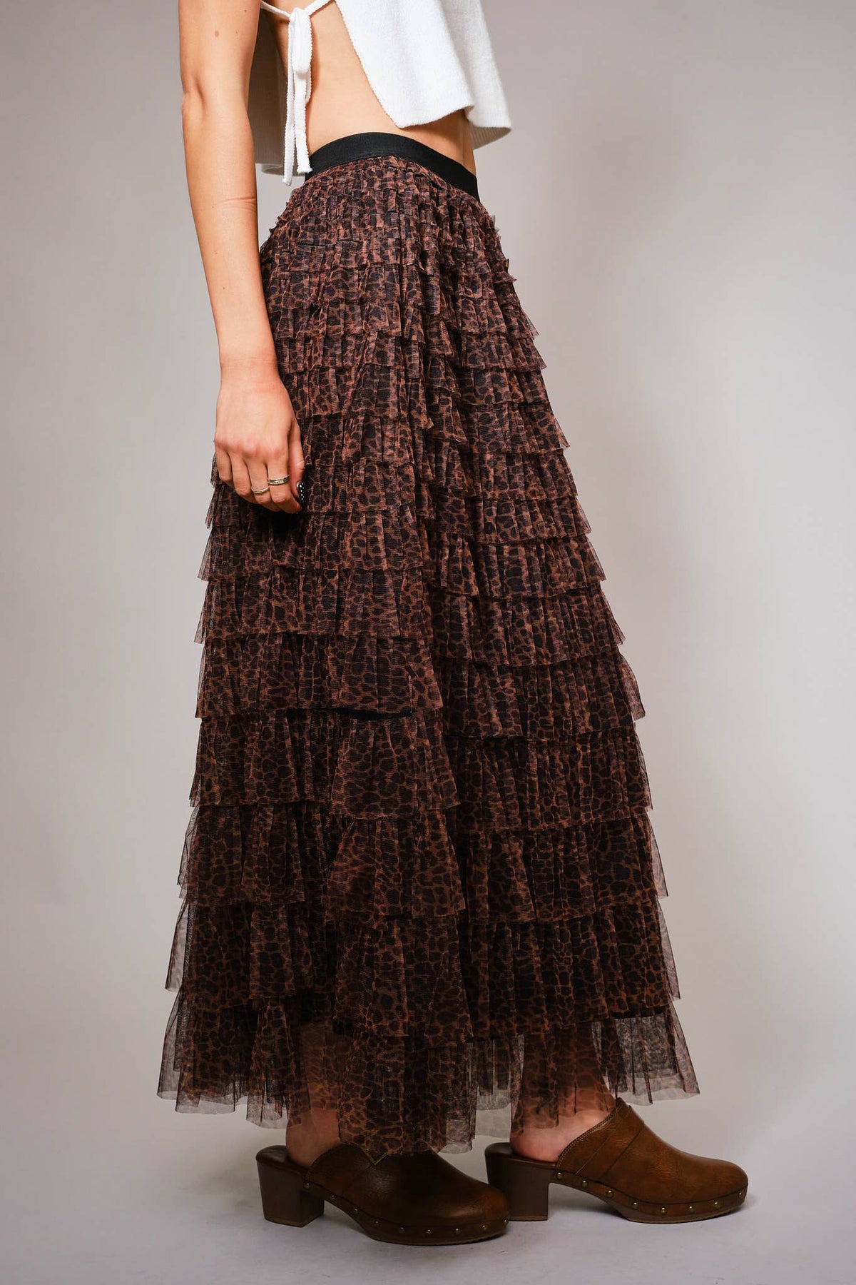 Side view showing the flowing A-line shape and mesh ruffle tiers of the leopard maxi skirt