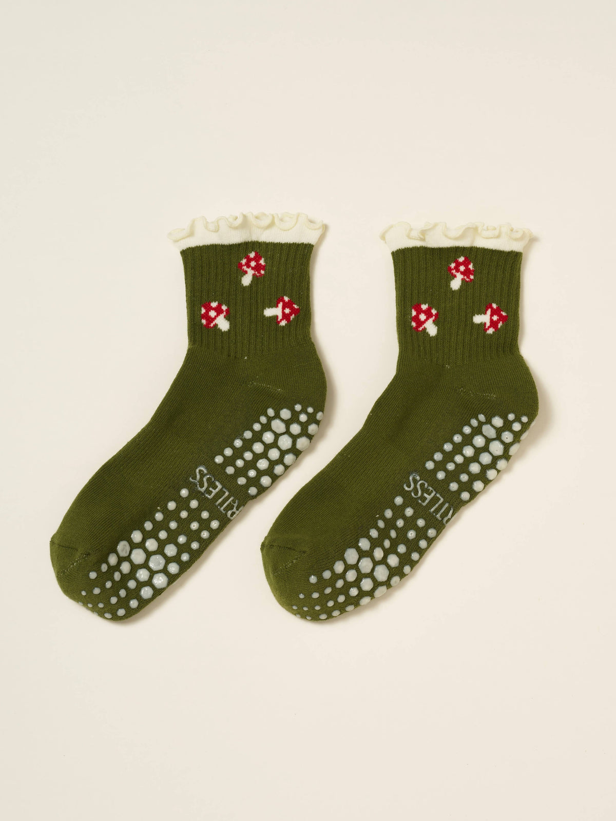 Pair of olive mushroom socks showing the white non-slip grip soles