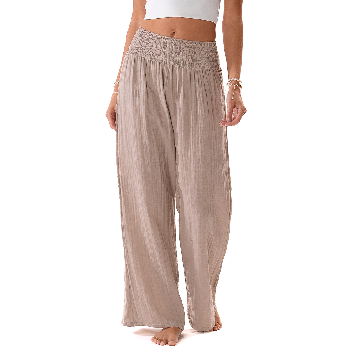Beige wide-leg pants worn by a person on a white background