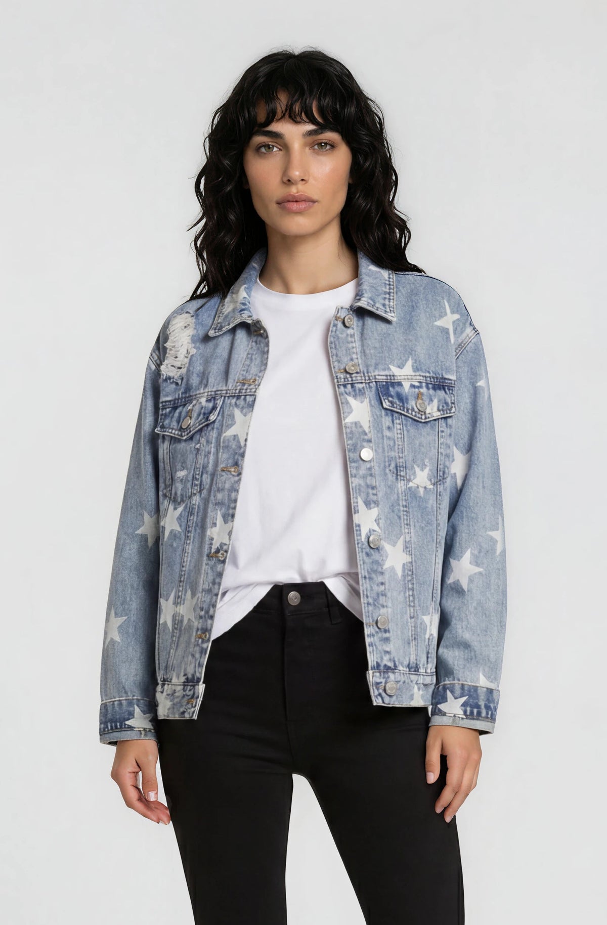 Washed blue denim jacket with star detail and vintage trucker fit