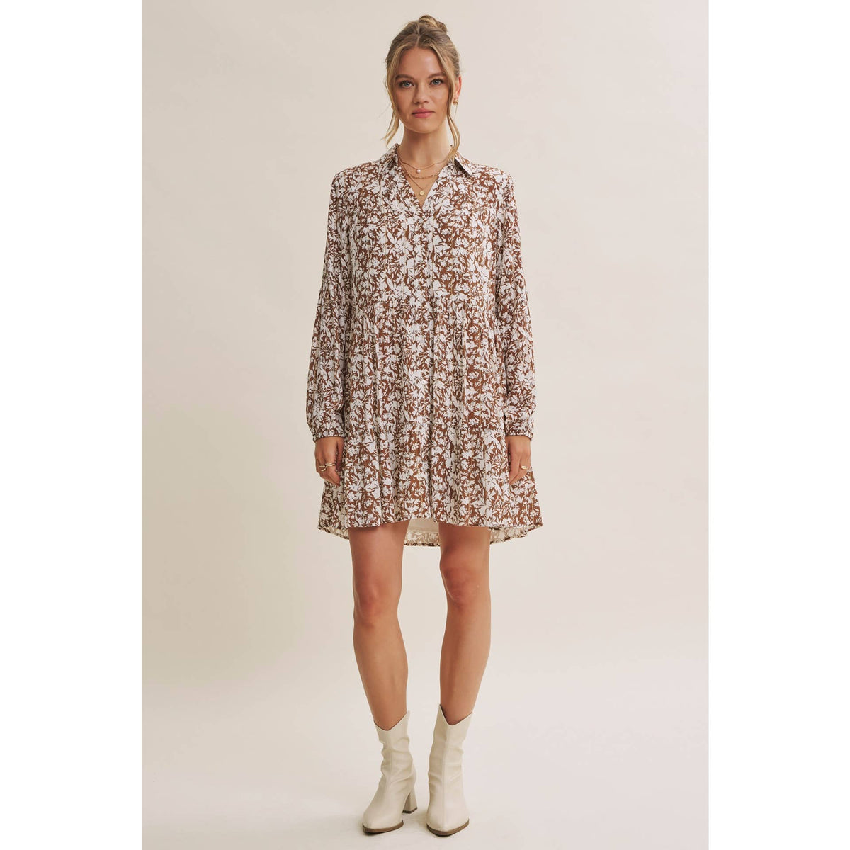 Full-length front view of the Soft Autumn floral mini dress styled with cream ankle boots.