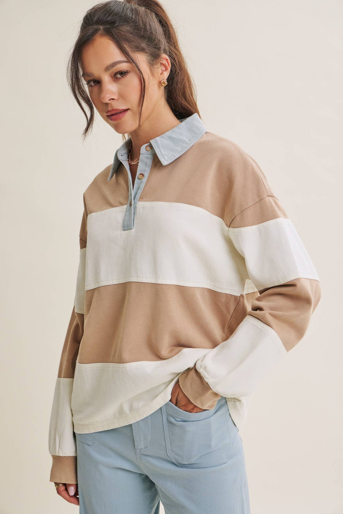 Heritage Weekend striped rugby top in Latte Combo, styled with a front tuck into light-wash jeans.