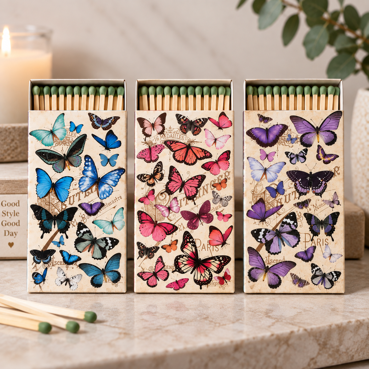 Butterfly collage decorative matchboxes in blue, pink and purple designs with green-tip matches