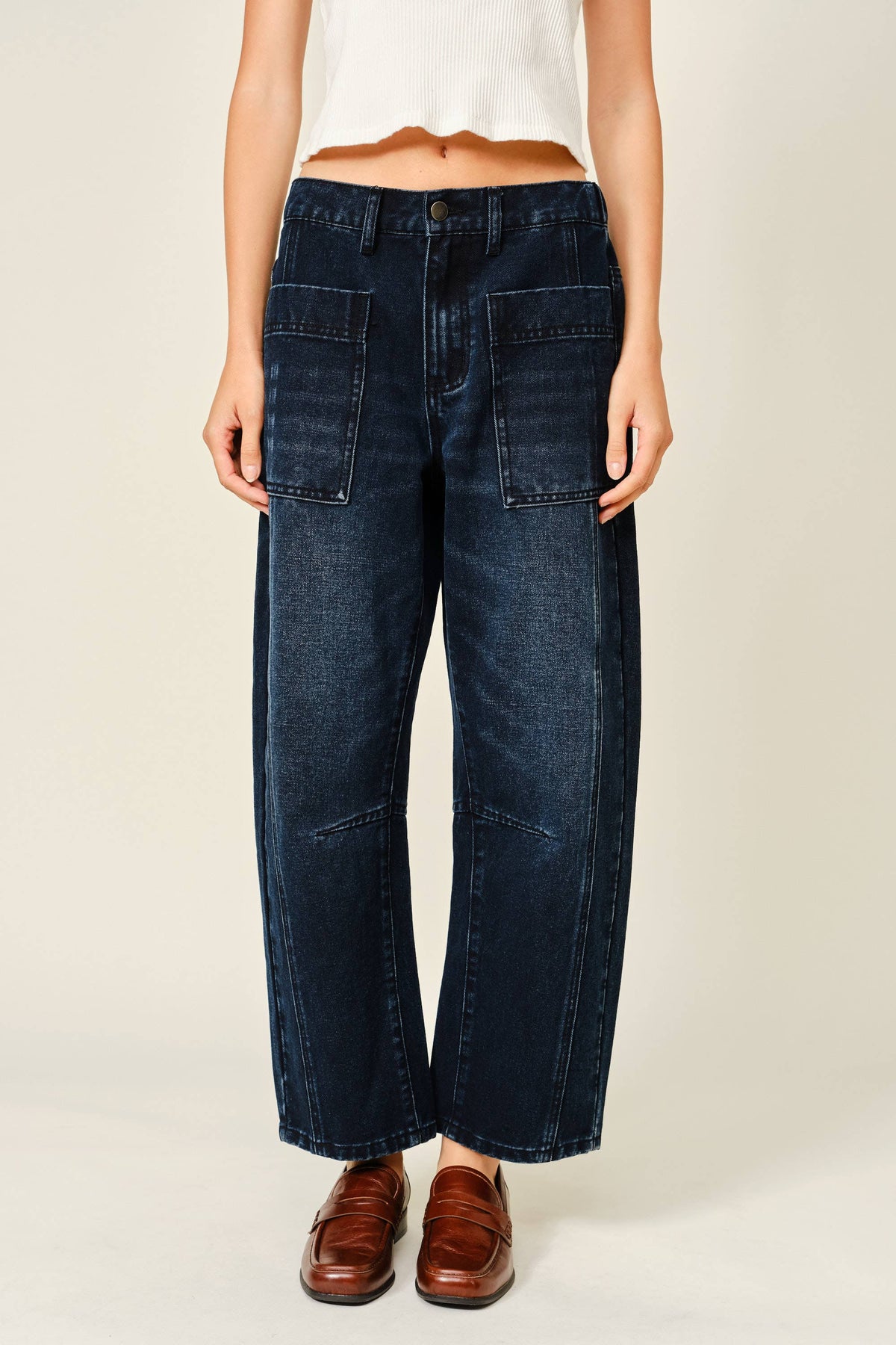 Dark wash barrel jeans with utility pockets, front view