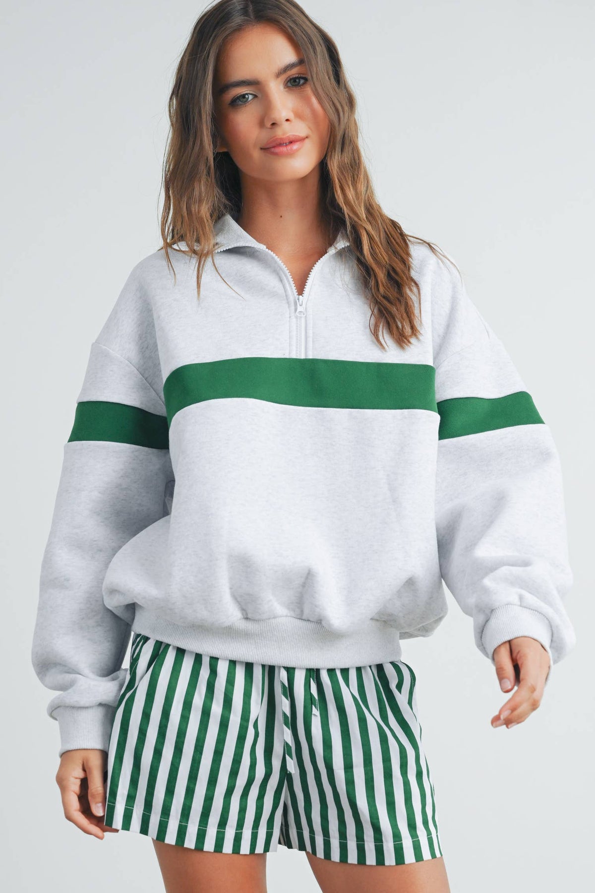 Front view of grey and green two-tone sweatshirt