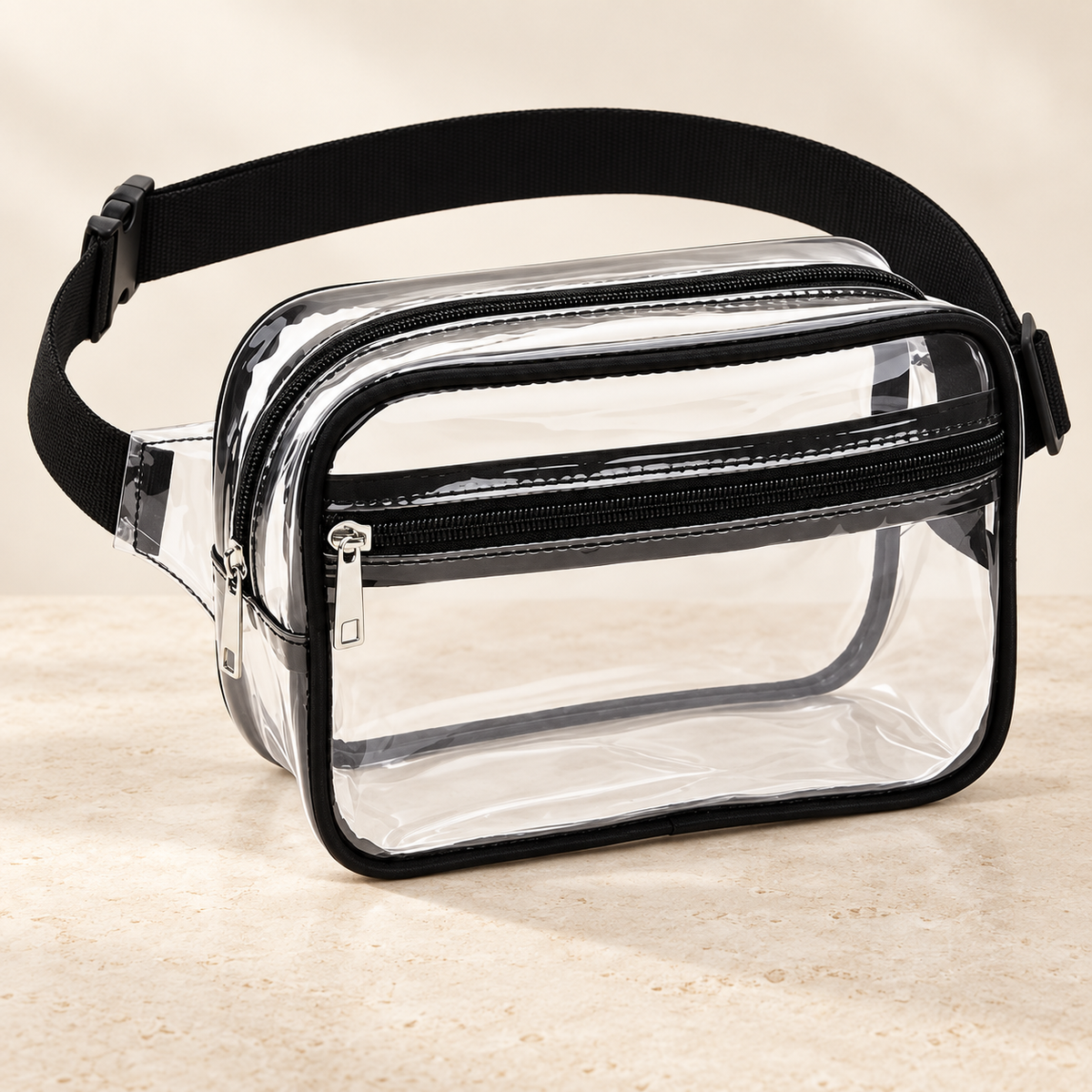 Clear Edit belt bag with black trim on warm ivory stone