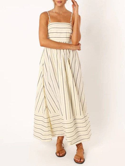 Woman wearing a striped dress on a white background